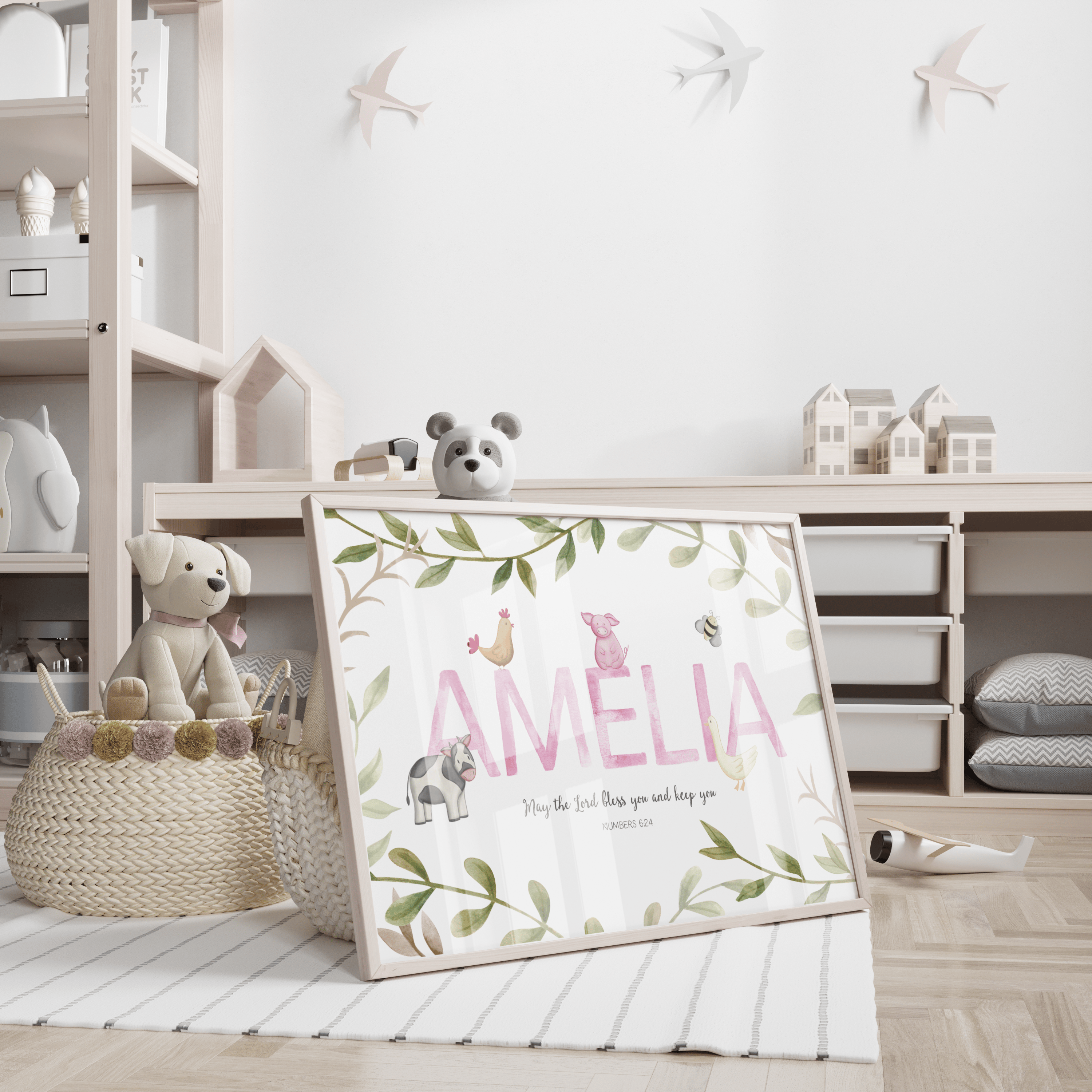 Children's room with a personalized name sign and toys on shelves.