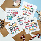 Set of Christmas-themed cards with decorative elements on a light blue background