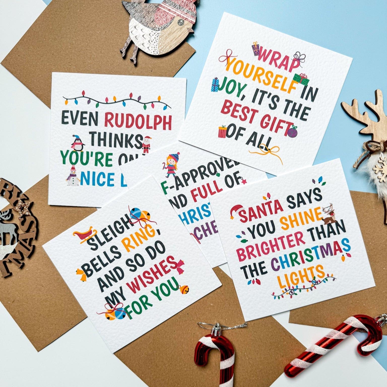 Set of Christmas-themed cards with decorative elements on a light blue background