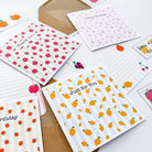 Personalisable greetings card with a variety of fruit themes on a striped backdrop