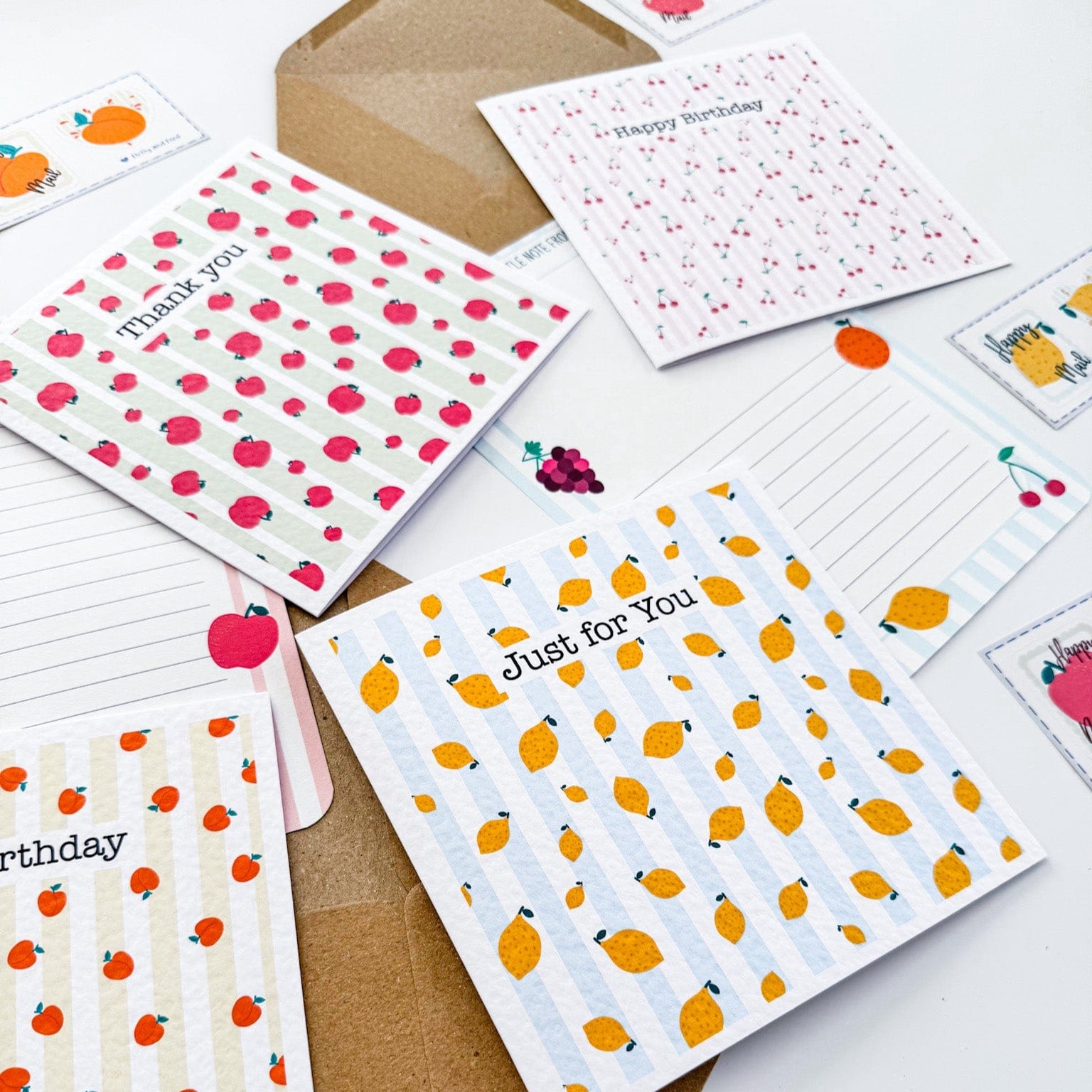 Personalisable greetings card with a variety of fruit themes on a striped backdrop