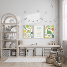 Set of 3 green dinosaur and personalised affirmation prints displayed above storage in a bright child's room.