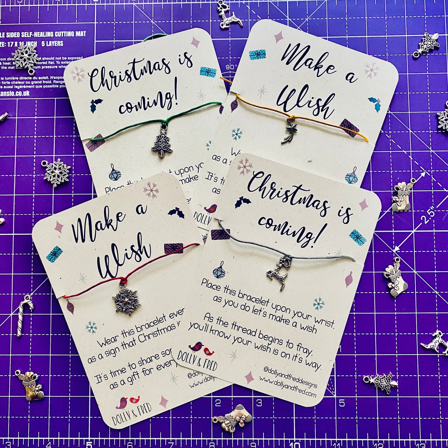 4 chirstmas charm wish bracelets on a purple background - free gift with all orders