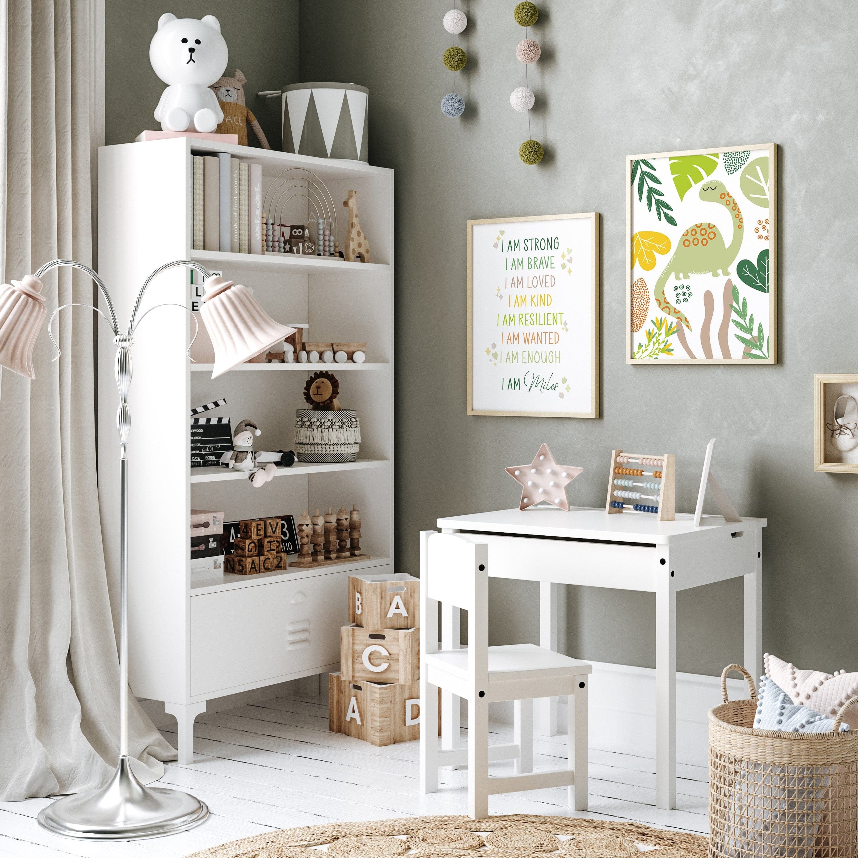 Dinosaur print trio with motivational quote styled in a white kids’ play area with chairs and shelves.
