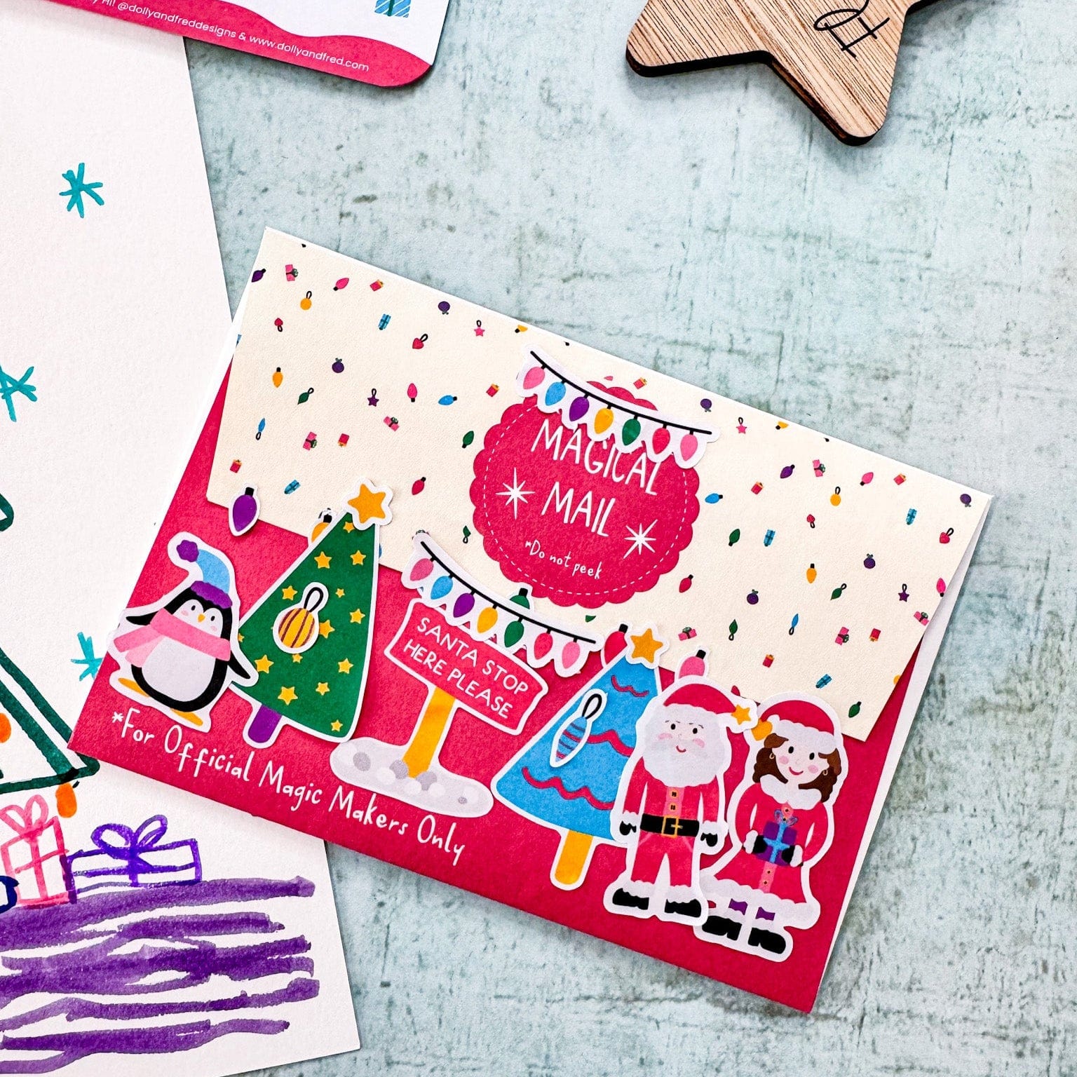 A festive envelope decorated with lots of christmas stickers