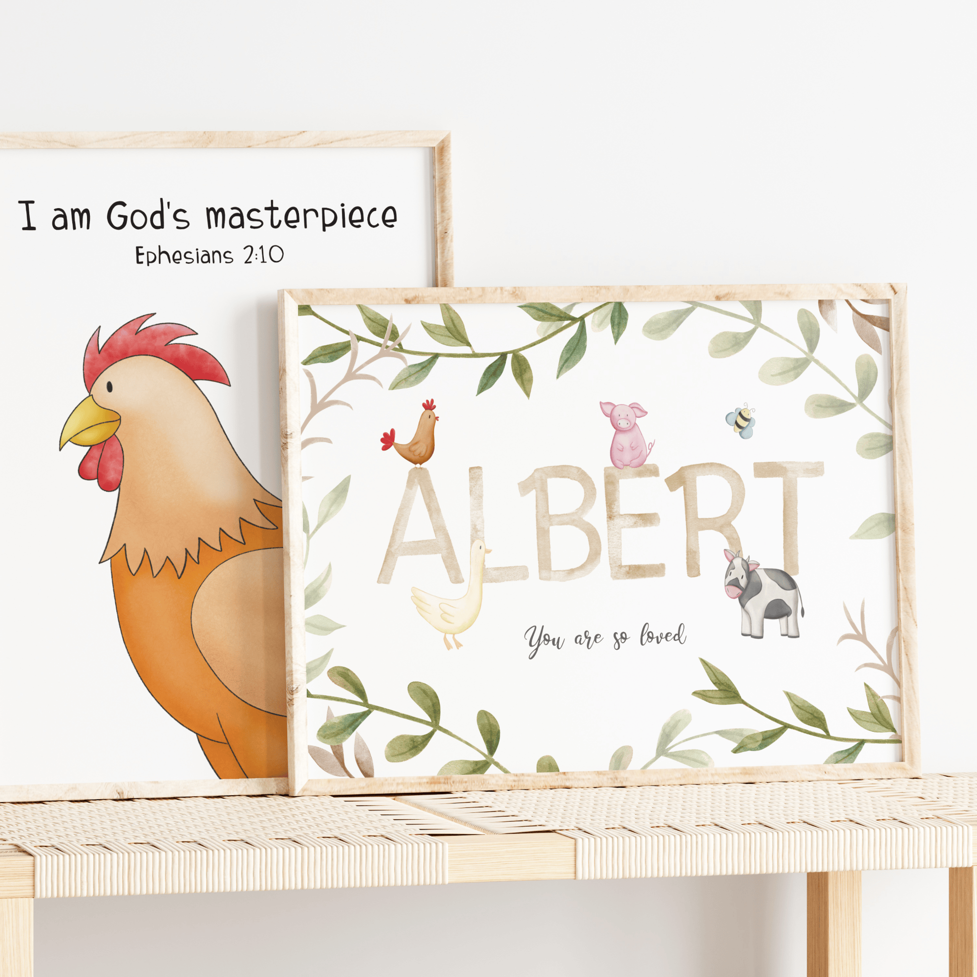 Two framed prints on a shelf with a rooster illustration and text, one named 'Albert'.