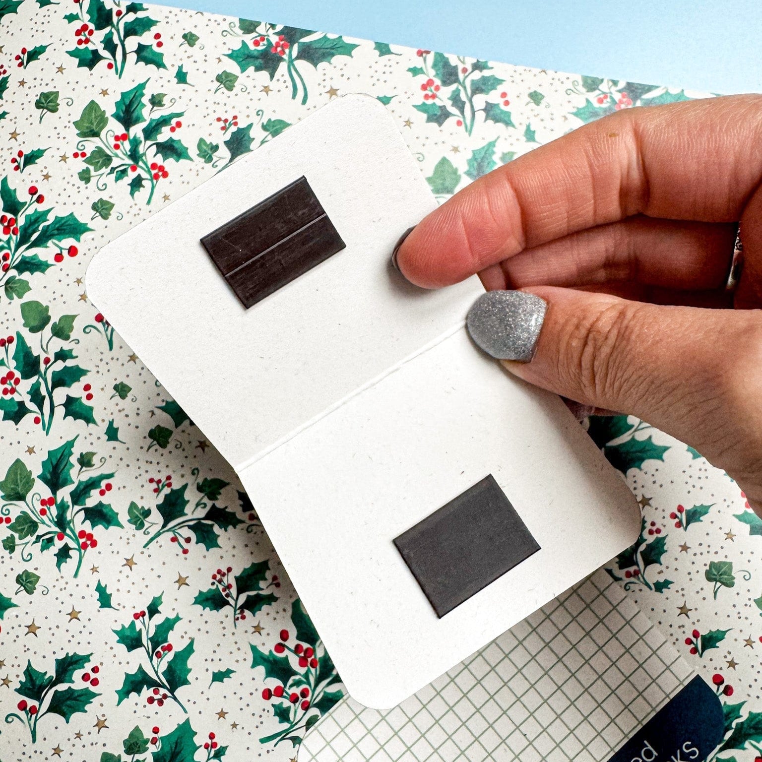 Inside of magnetic bookmark, showcasing the magnets