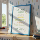 Single green dinosaur print leaning against a wall