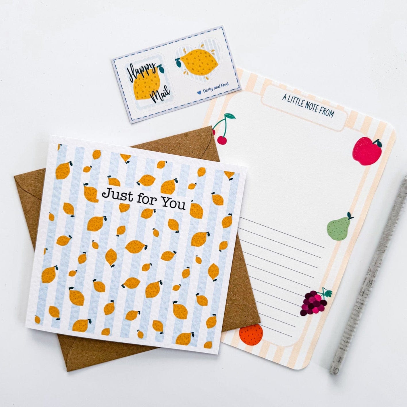 Front of lemon stripe greetings card with 'thank you' message, kraft envelope, and stickers