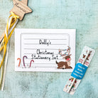 flatlay of the packaging for the personlaised christmas stationery set with envelope