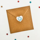 Kraft brown envelope sealed with a matching heart shaped sticker