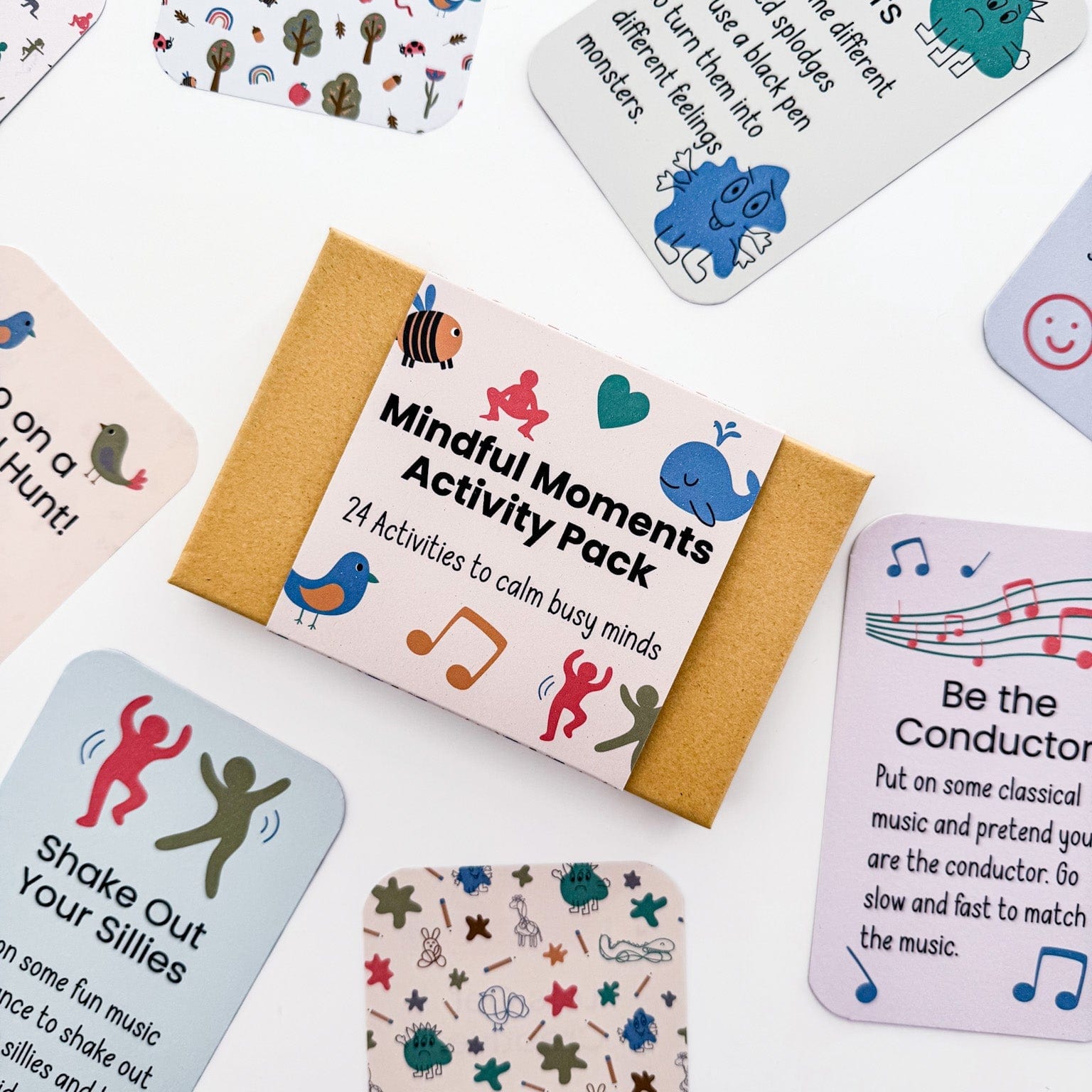 Flat lay of Mindful Moments Activity Pack showing mindfulness cards and eco-friendly kraft storage box.