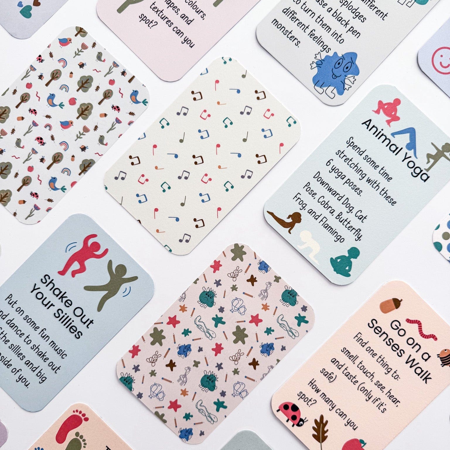 Collection of illustrated mindfulness activity cards for kids showing reverse patterned side.