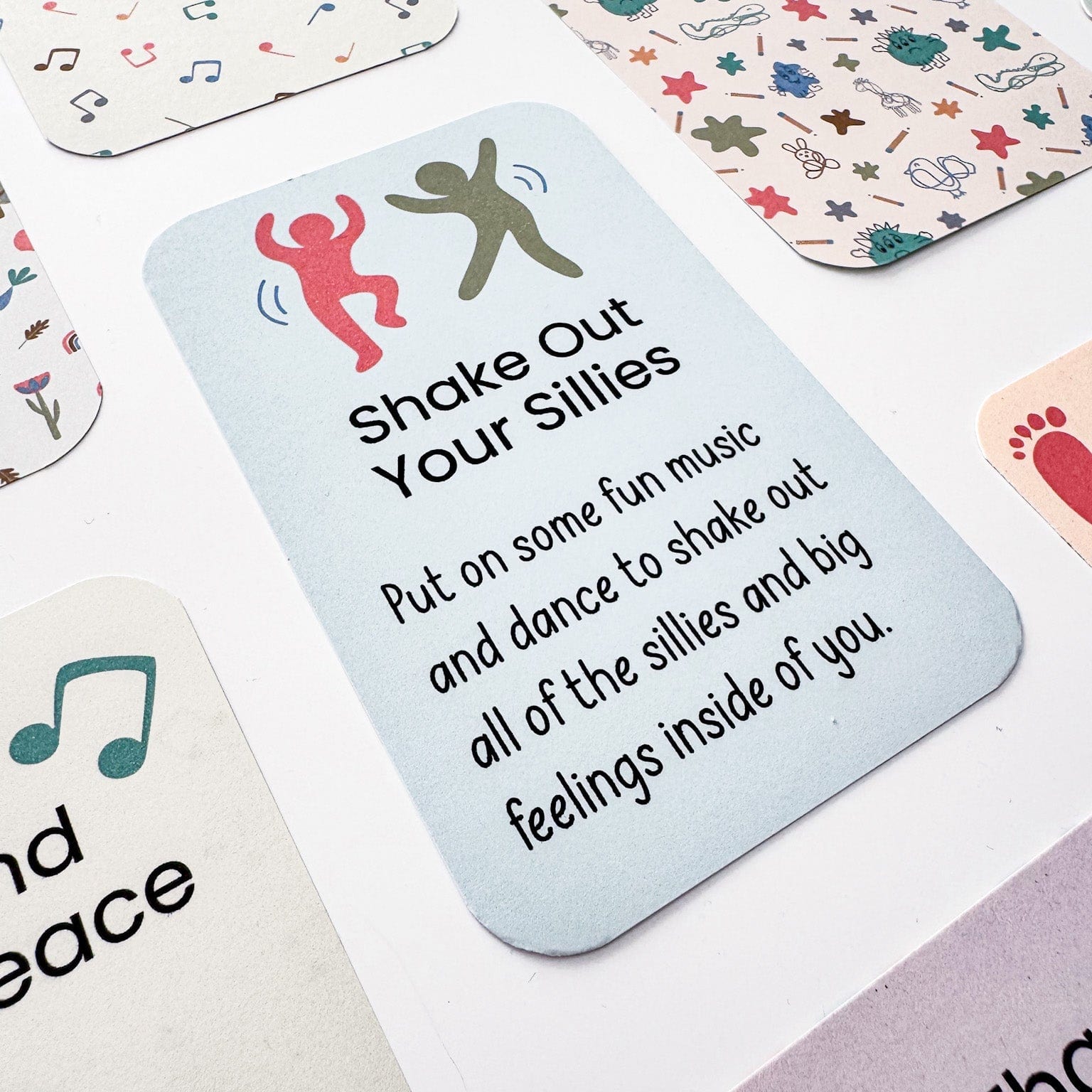 “Shake Out Your Sillies” music activity card from the Mindful Moments set for calming play.