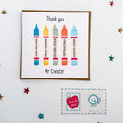 personalised teacher thank you card, featuring a rainbow crayon design and the name "Mr Chester" – with matching envelope sealing stickers.