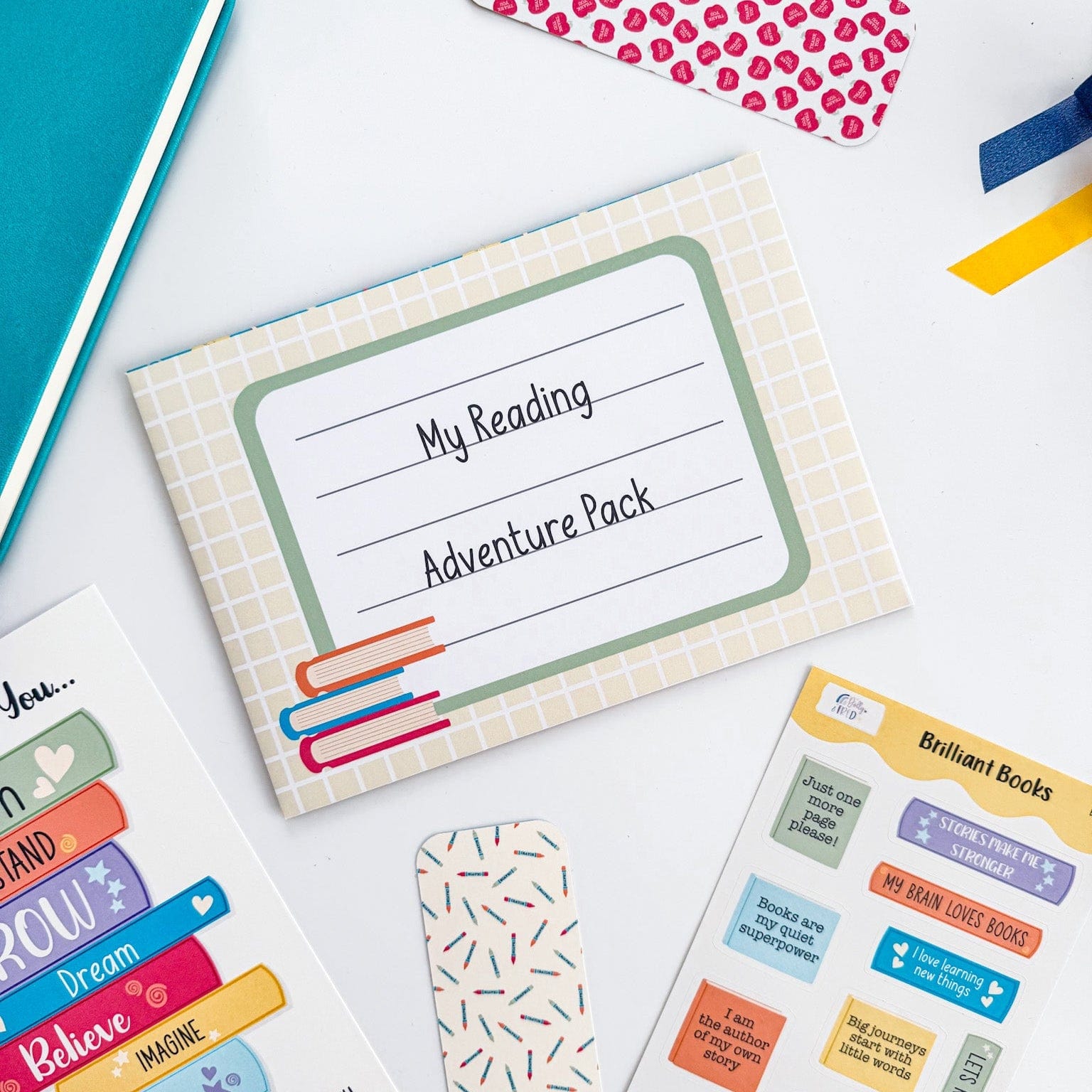 Packaged gift bundle for reading corners, including stickers, print, and bookmark for kids.