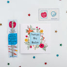 Flat lay of teacher card and thank you pencil gift bundle with colourful stars.