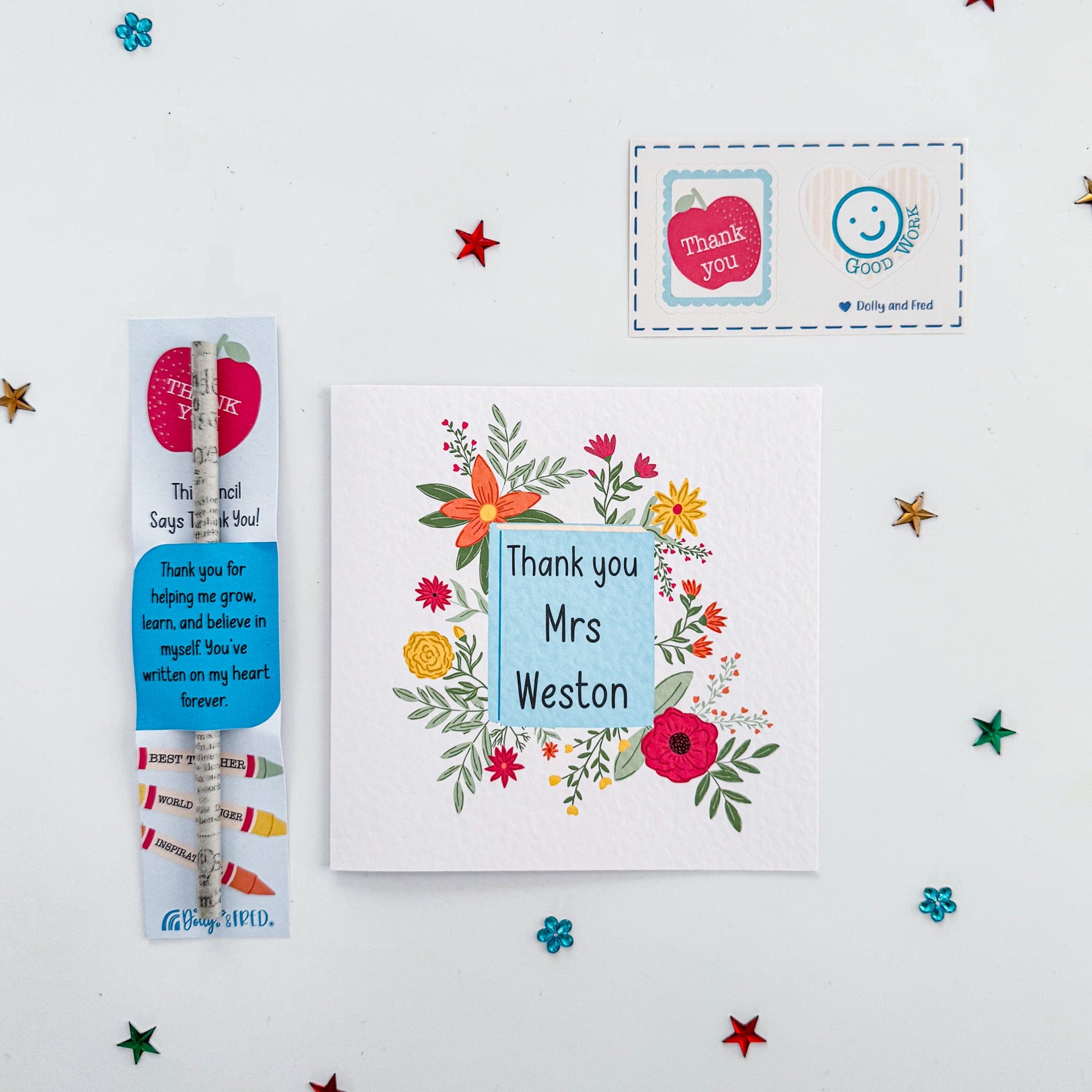Flat lay of teacher card and thank you pencil gift bundle with colourful stars.
