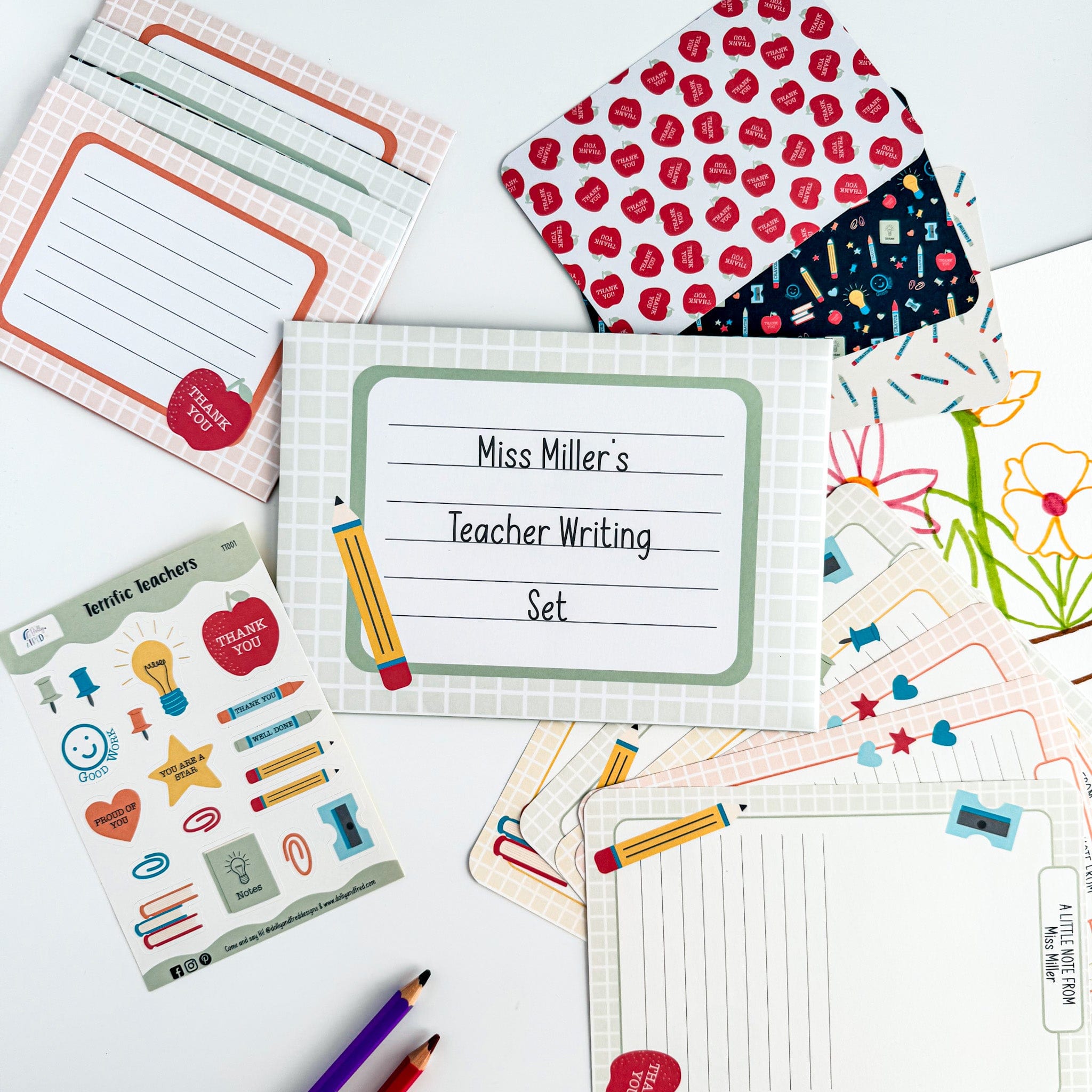 Opened packaging showing contents of the colourful teacher writing gift set.