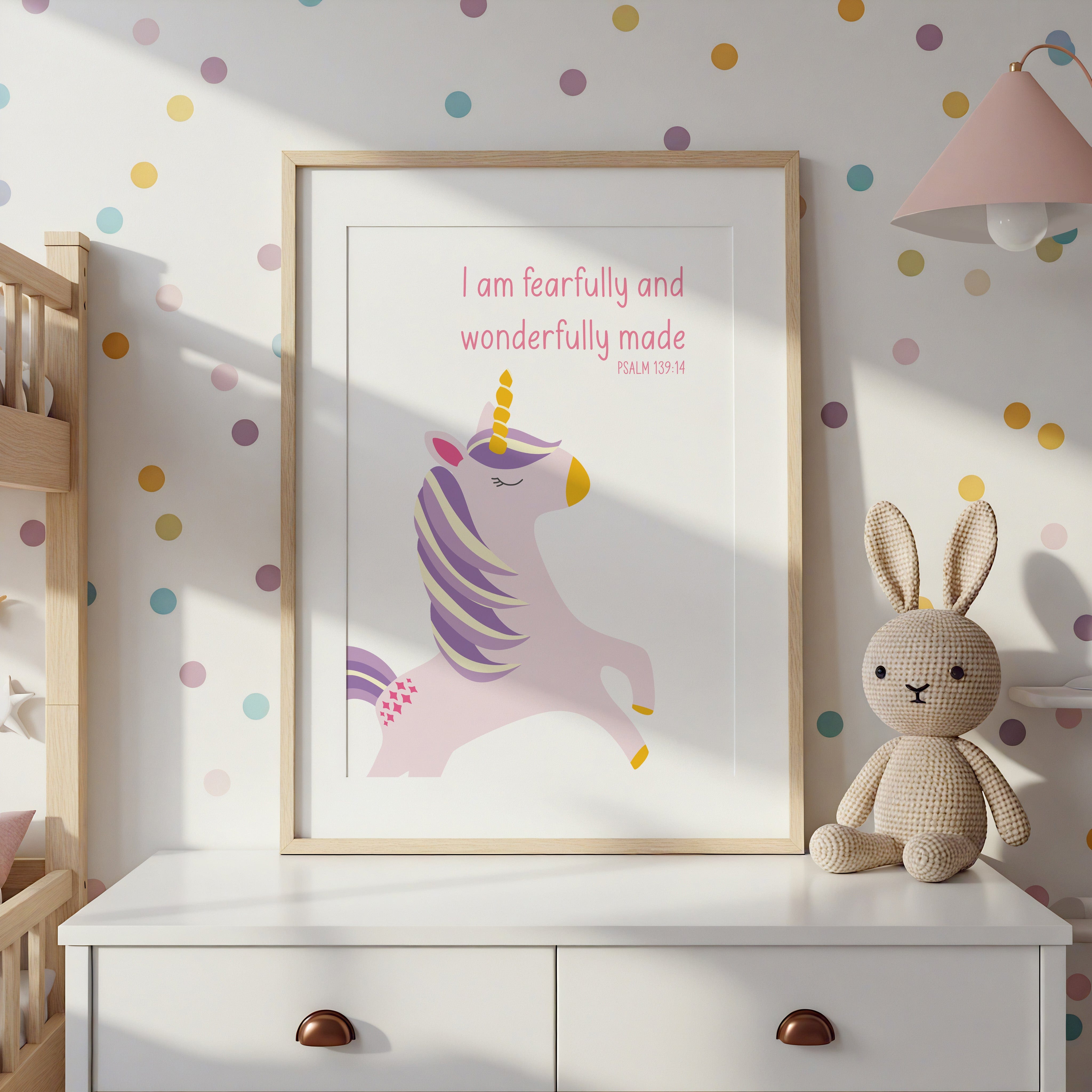 Framed unicorn and Bible verse print displayed in a pastel nursery – personalised Christian prints with soft colours and illustrations