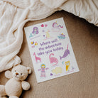 Flat lay of adventure writing print with teddy bear and neutral blanket – gentle and calming nursery inspiration.