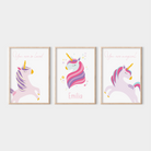 Set of 3 framed unicorn prints on a white wall – includes personalised name print and two affirmation prints with whimsical unicorn illustrations in soft pastel tones