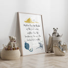 Children's room with framed artwork, stuffed animals, and baskets on a wooden floor.