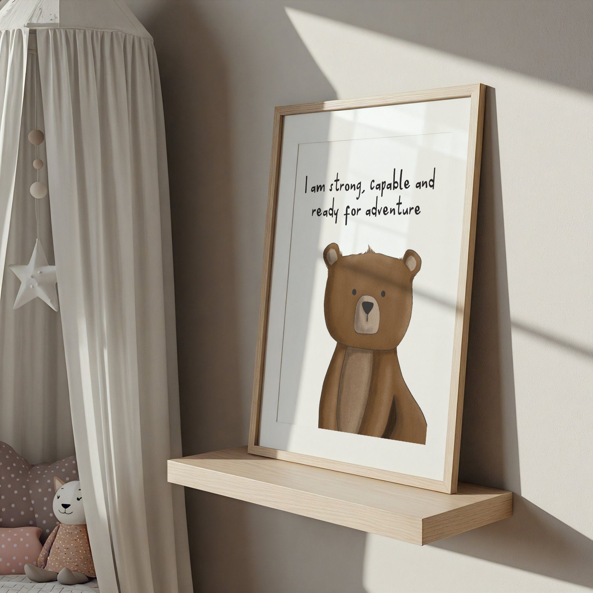 Framed picture of a bear with text on a shelf in a child's room