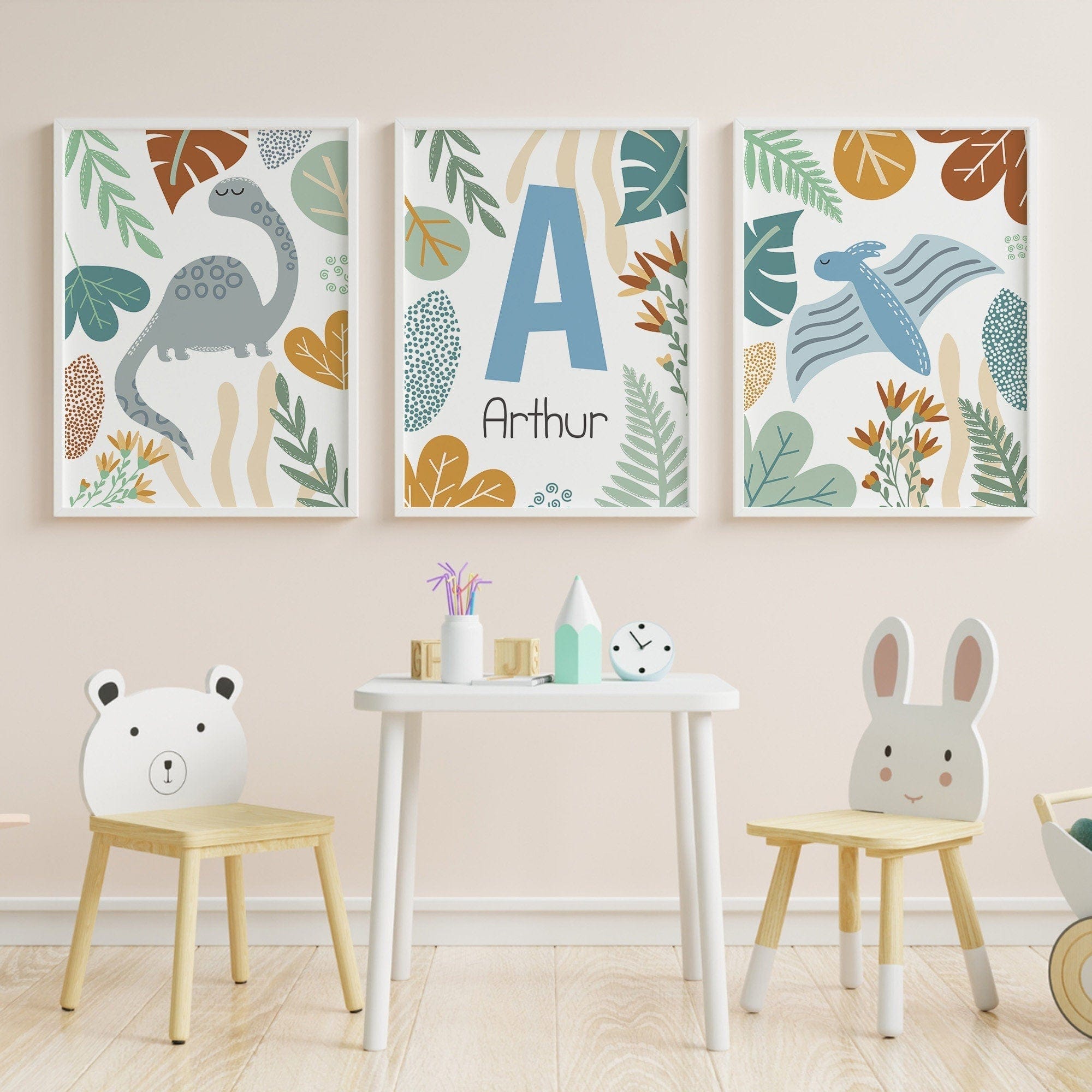 Children's room with dinosaur-themed wall art, chairs with animal faces, and a small table.