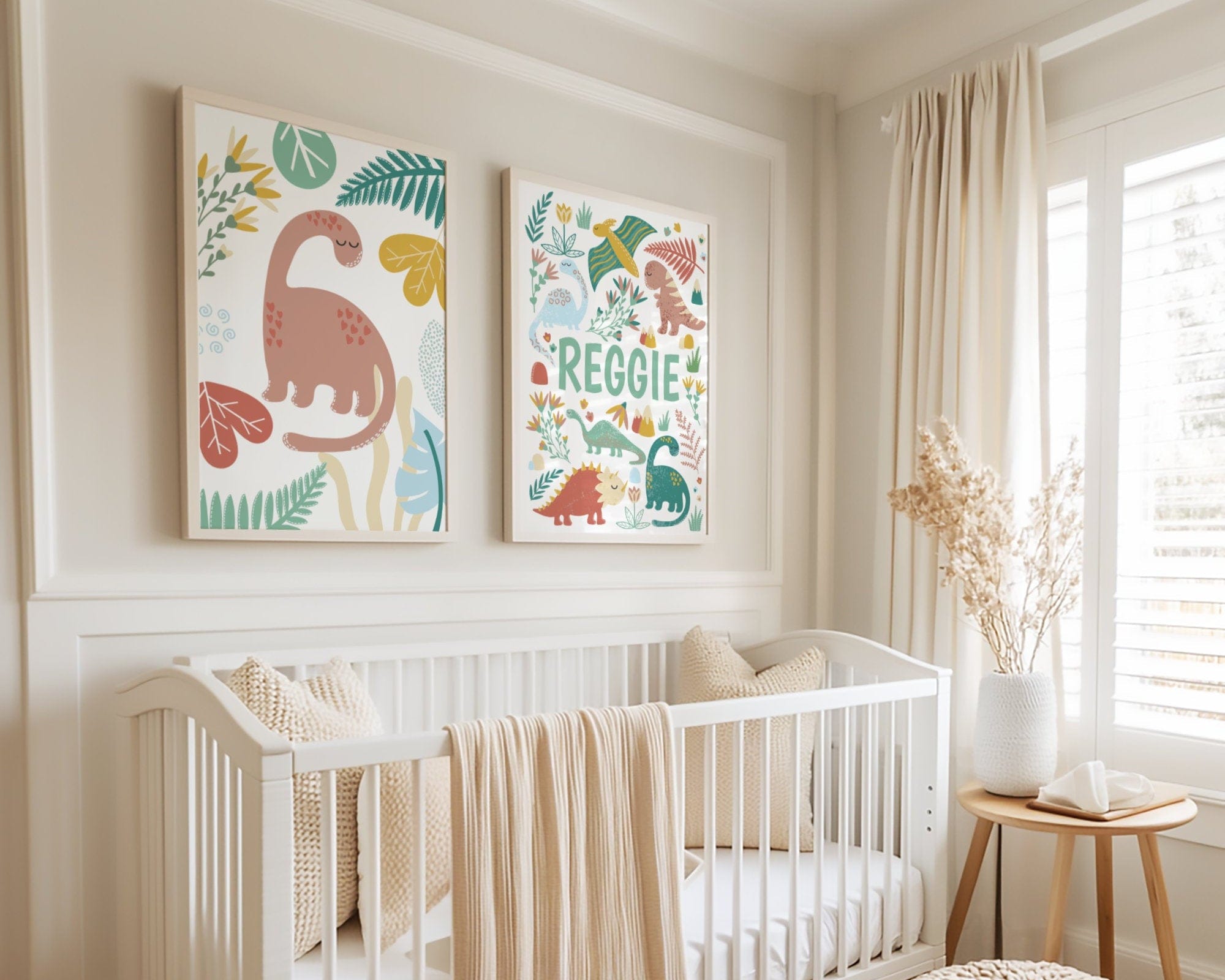 Nursery room with a crib, decorative pillows, and wall art featuring dinosaurs.