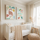 Nursery room with a white crib, decorative pillows, and wall art featuring dinosaurs and the name 'Reggie'.