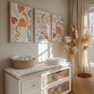 Nursery room with decorative wall art, a dresser, and a window.