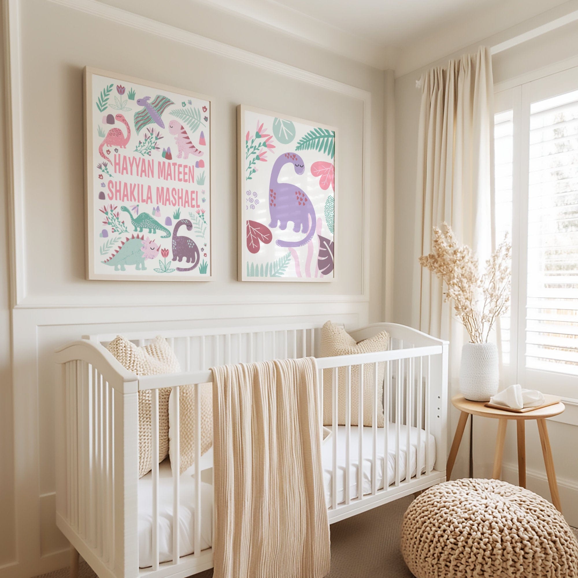 Nursery room with a crib and framed pink dinosaur artwork on the wall.