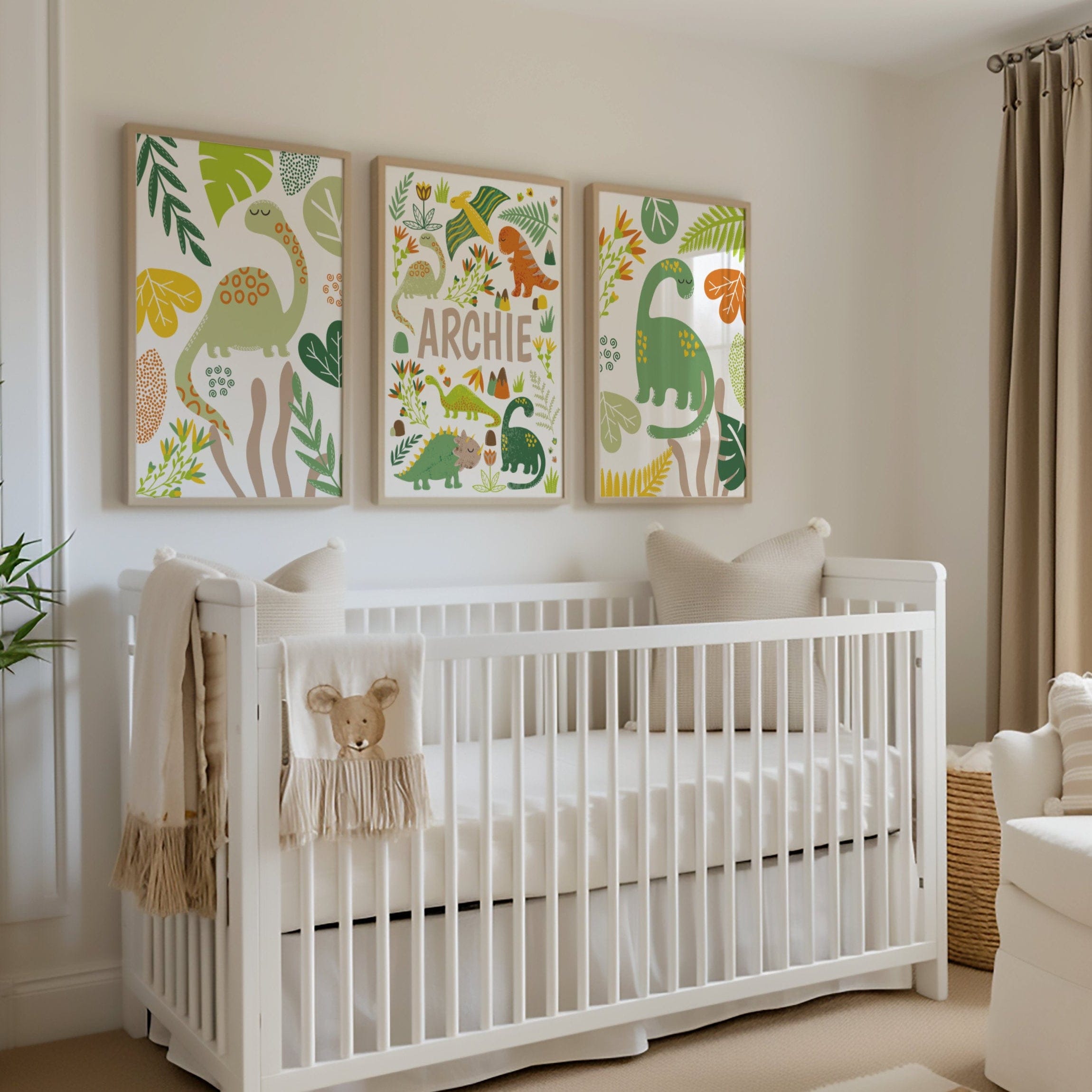 Nursery room with a white crib, decorative pillows, and wall art featuring dinosaurs and the name 'Archie'.