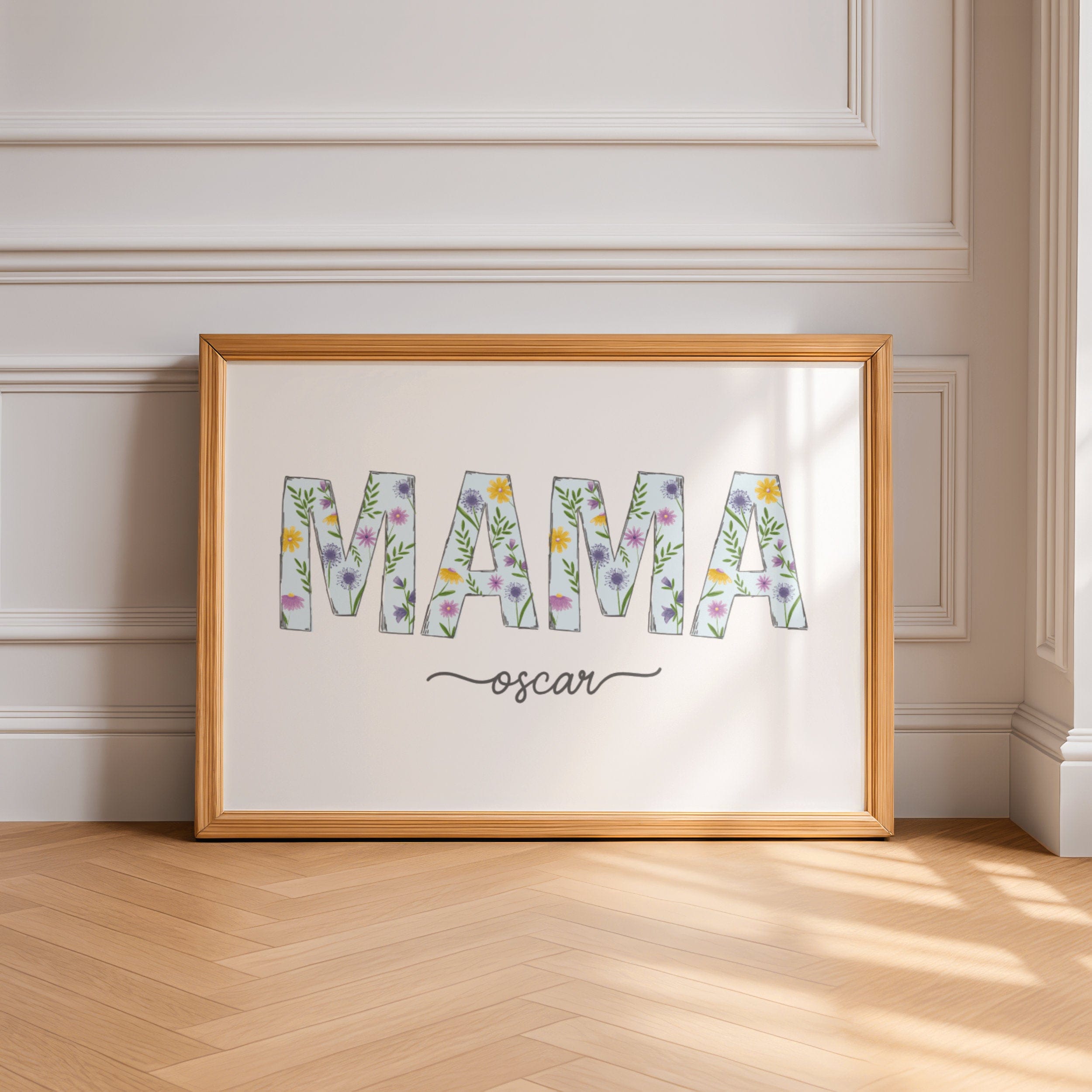Framed artwork with 'MAMA' and 'oscar' text on a wall.
