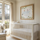 Childrens nursery with frame on the wall featuring the name Henry surrounded by fram animals and a bible verse