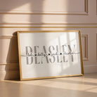 Framed artwork with a surname and family names on a wall with decorative moulding