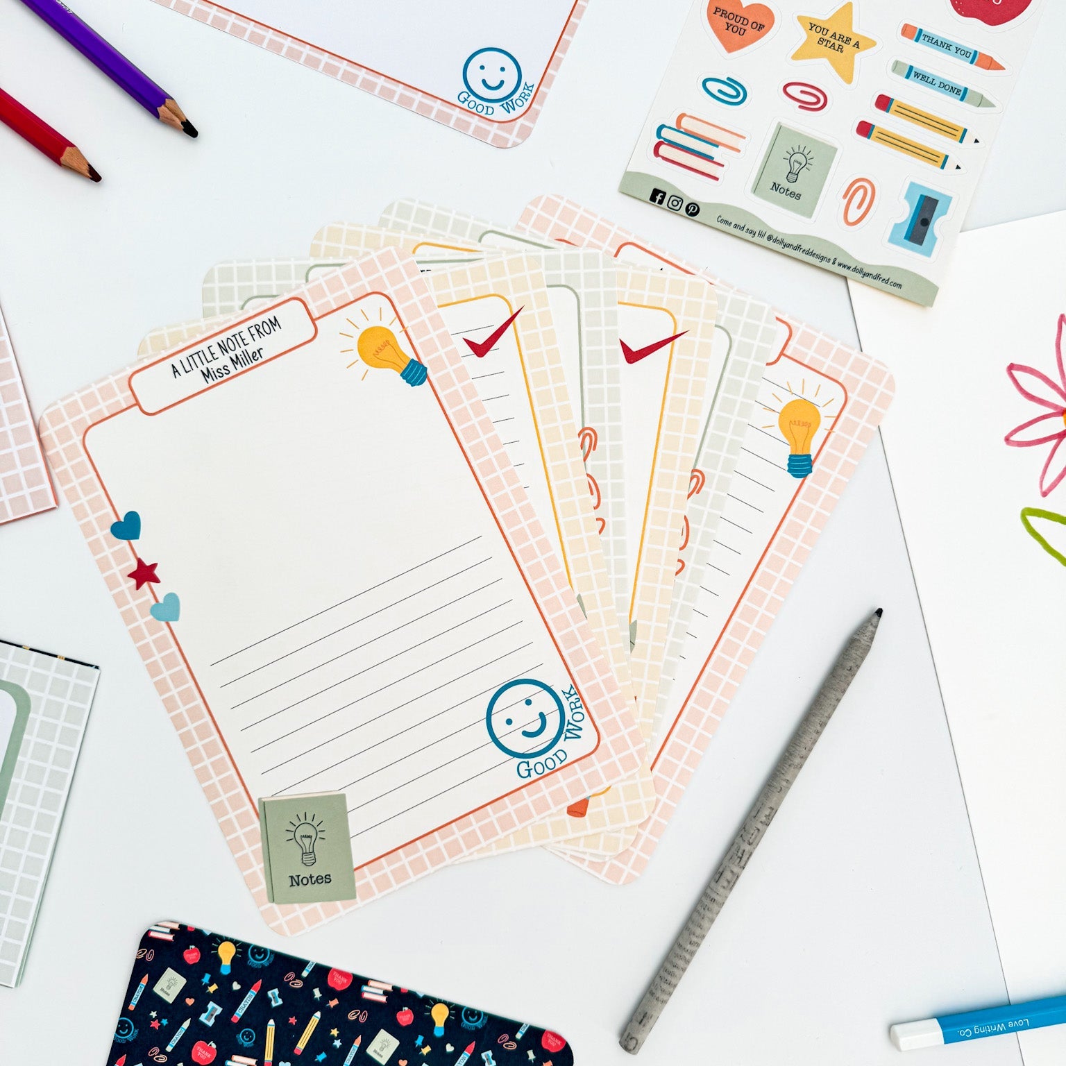 Close-up of personalised writing paper for teachers with colourful pens.