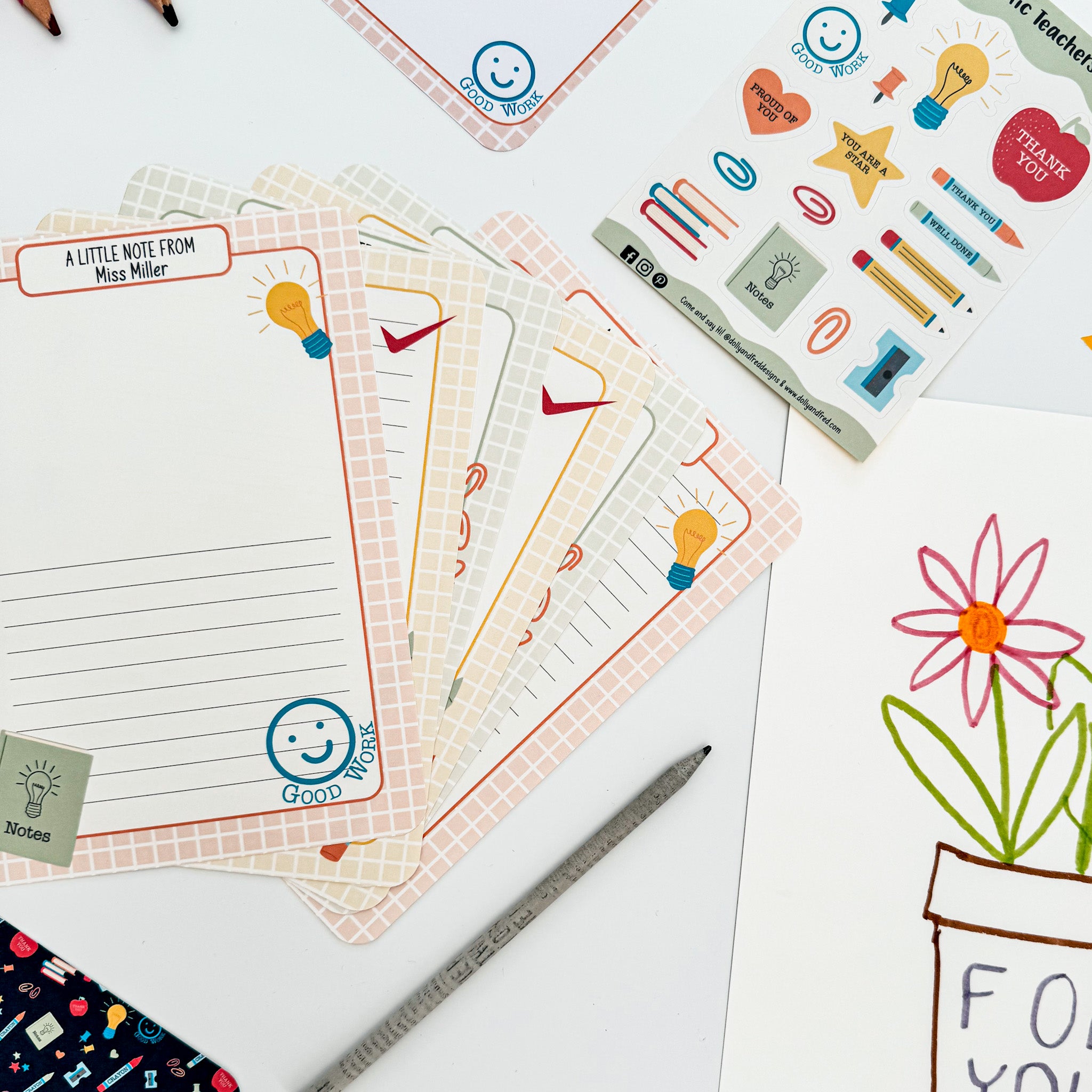 Top view of end-of-term teacher writing set with letter paper, bookmarks and stickers.